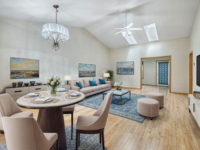 Virtually staged living room and dining area with plenty of room for your personal touch. | Image 8