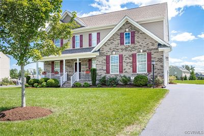 View of front of house with a porch and a front yard | Image 3