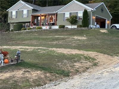 View of front of property with covered porch | Image 1