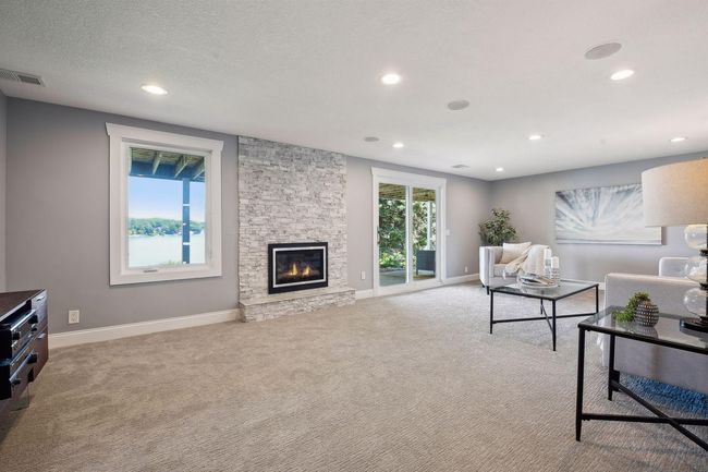 Walkout lower level has great ceiling height, knock down ceilings, in ceiling lighting, and built in speakers. | Image 21