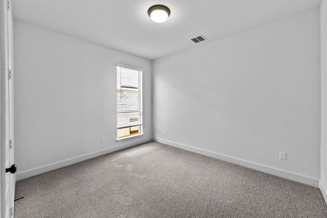 Carpeted empty room featuring baseboards | Image 21