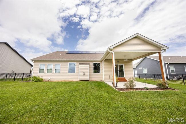 Fully fenced back yard with wrought iron fencing | Image 28