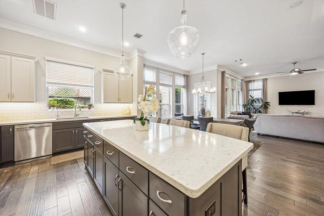 This room gets plenty of natural light from the outdoor patio. | Image 15
