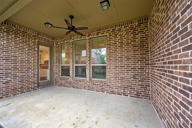 View of patio featuring ceiling fan | Image 34