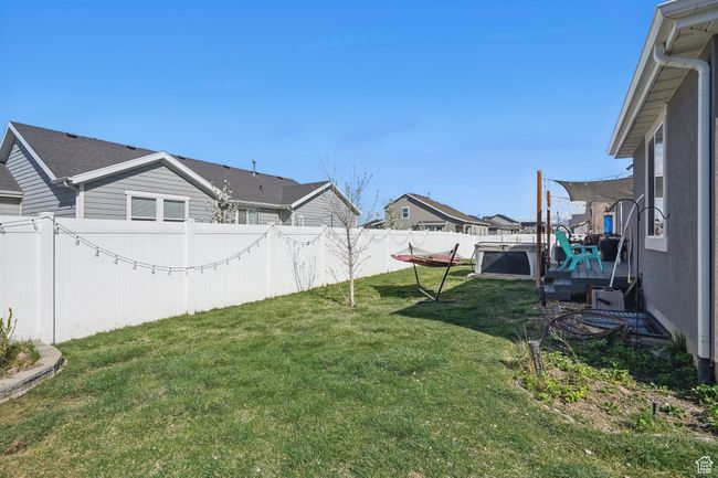 View of yard featuring a fenced backyard and a residential view | Image 48