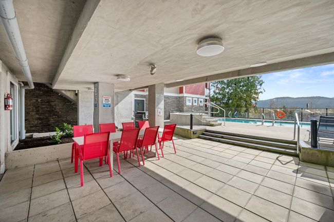 View of patio featuring a mountain view and outdoor dining area | Image 38