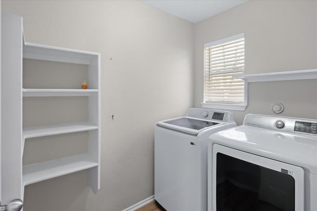 Laundry room featuring laundry area and washer and dryer | Image 16