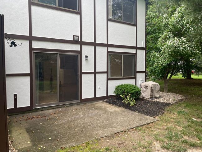 Entrance to property with stucco siding and a patio | Image 20