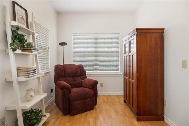 Living area with light wood-style flooring and baseboards | Image 20