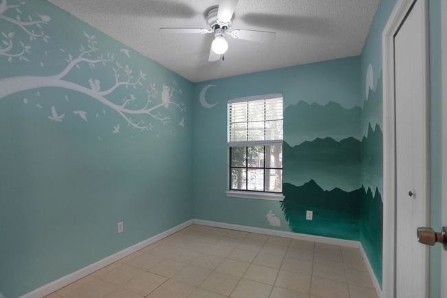 Second Bedroom featuring a hand painted scene | Image 21