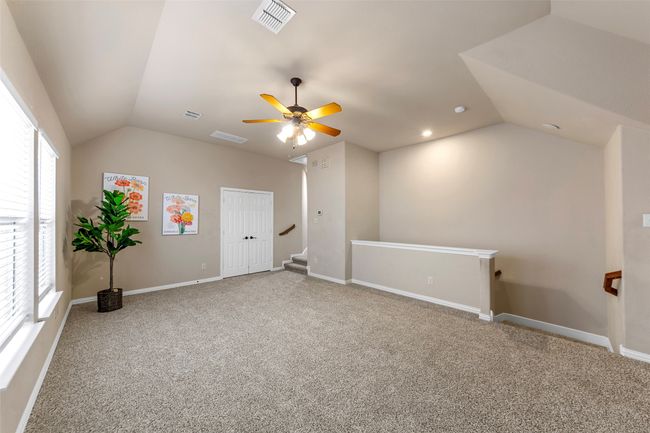 Empty room with ceiling fan, baseboards, crown molding, wood finished floors, and recessed lighting | Image 28