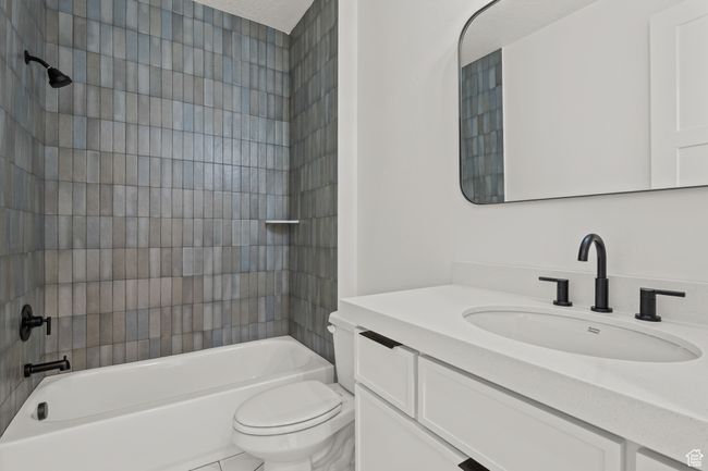 Bathroom featuring shower combination, vanity, and tile patterned flooring | Image 59