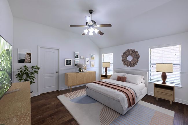 Bedroom featuring vaulted ceiling, a ceiling fan, wood finished floors, and baseboards | Image 5