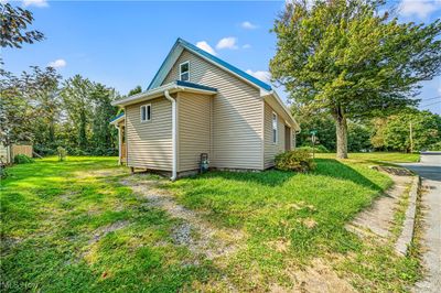 View of side of home featuring a lawn | Image 3