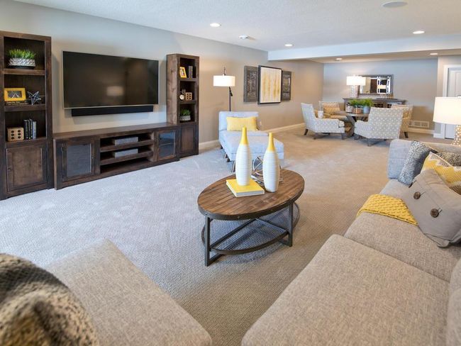 Finished Lower Level includes wet bar and 2 more bedrooms + storage rm. Photos may not depict actual home plan configuration. Features/materials/finishes shown contain options that are not included in price. | Image 18