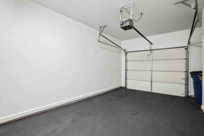 Garage with a garage door opener that has recently been painted. | Image 33