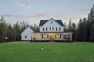 Modern inspired farmhouse featuring a porch and a lawn | Image 3