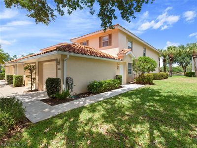 View of front of home featuring a garage and a front lawn | Image 1