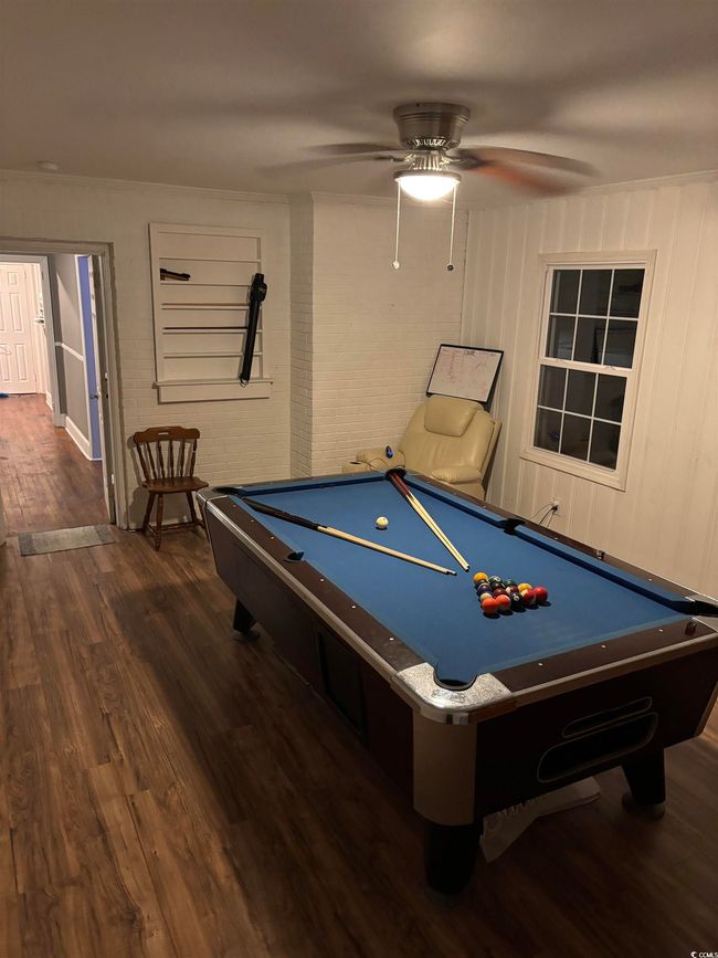 Rec room with billiards, dark wood finished floors, and ceiling fan | Image 15