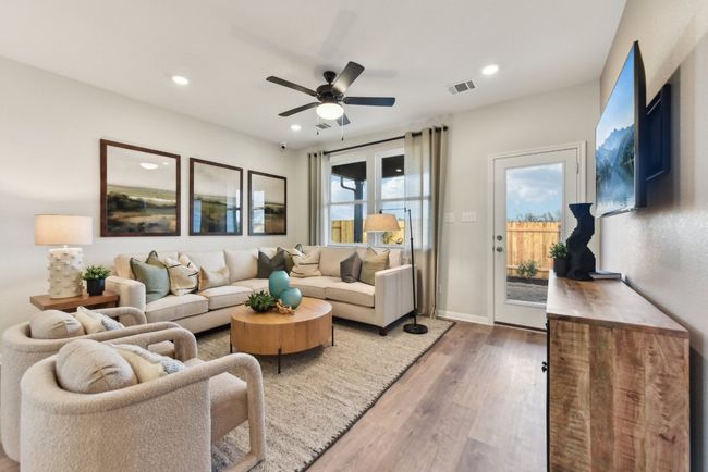 Living room with a ceiling fan, wood finished floors, and recessed lighting | Image 4
