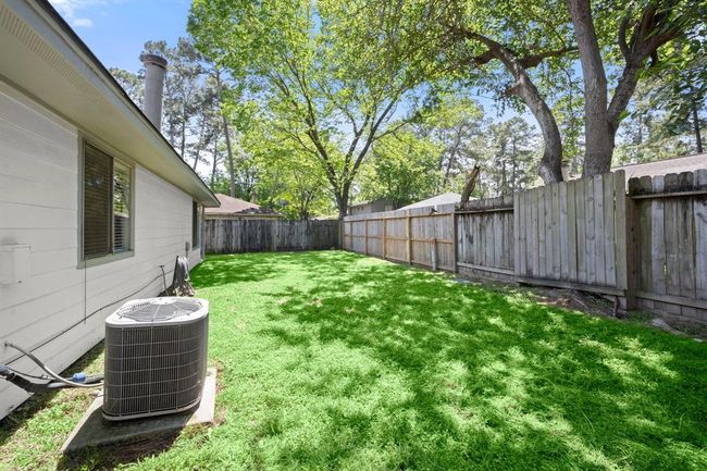 peaceful backyard with cleaned garden beds, mowed lawn | Image 30