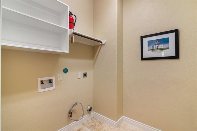 The laundry room has connections for electric and gas dryer. | Image 41