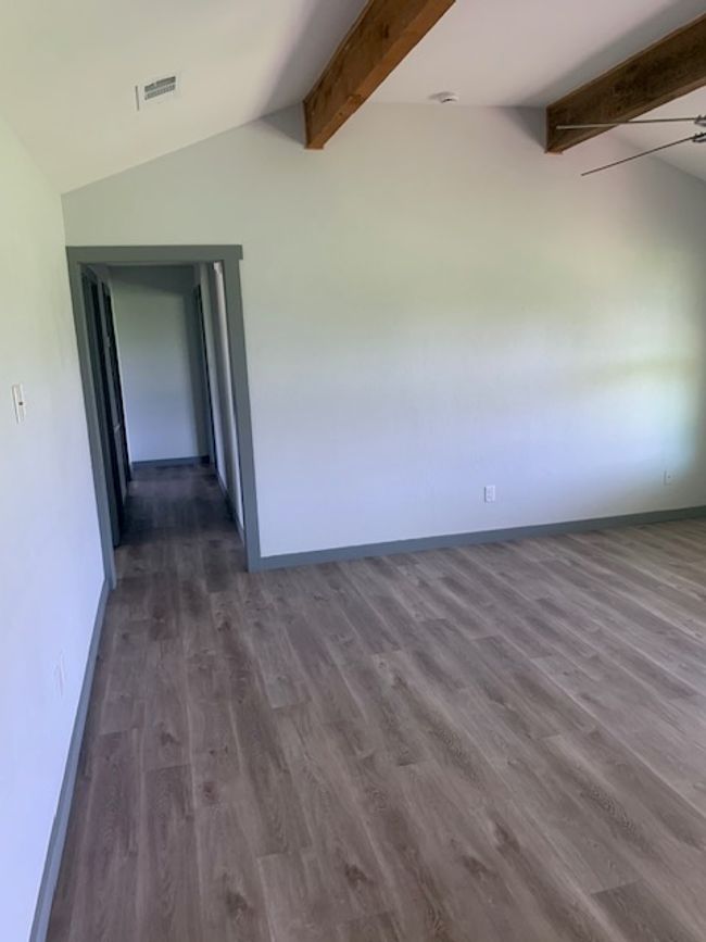 living room with beamed ceiling | Image 10
