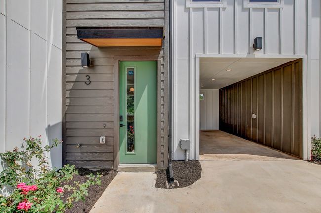 Entrance to property with board and batten siding | Image 25