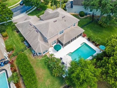 Drone shot shows the Cabana Style Pool and Deck. | Image 3