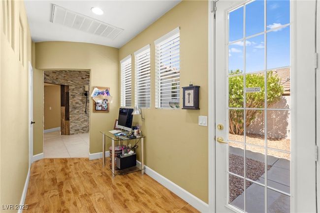 Corridor with healthy amount of natural light, light wood finished floors, and baseboards | Image 31