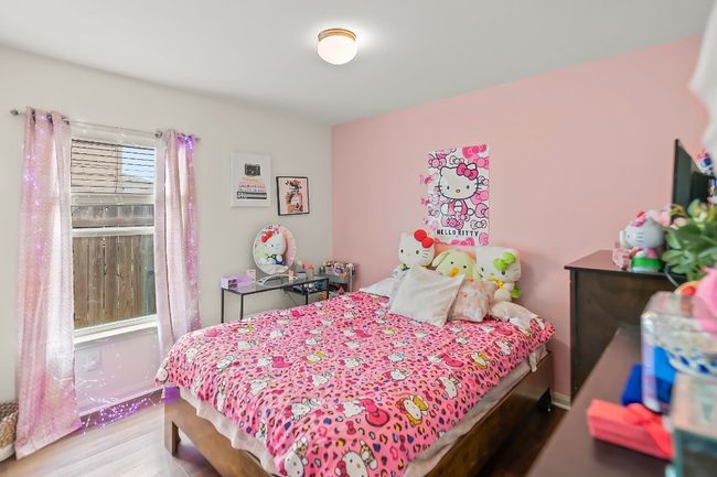 Bedroom with hardwood / wood-style floors | Image 15