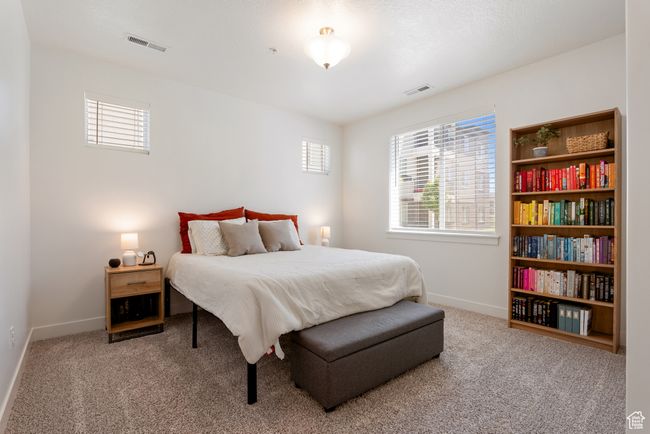 Carpeted bedroom with baseboards | Image 11
