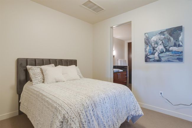 Bedroom with carpet flooring and ensuite bathroom | Image 23