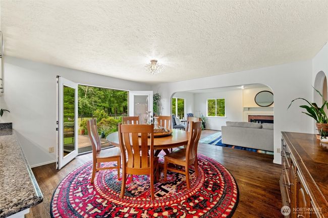 French doors from the dining area open to an expansive back patio, creating seamless indoor-outdoor flow. | Image 6