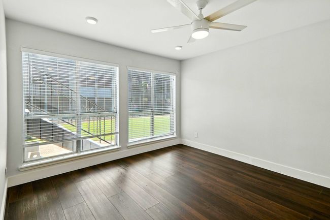 Unfurnished room featuring wood finished floors and ceiling fan | Image 9