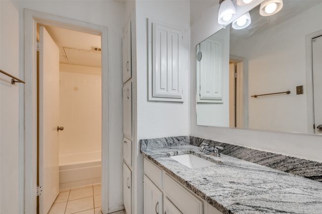 Primary bath with solid surface counters. | Image 15