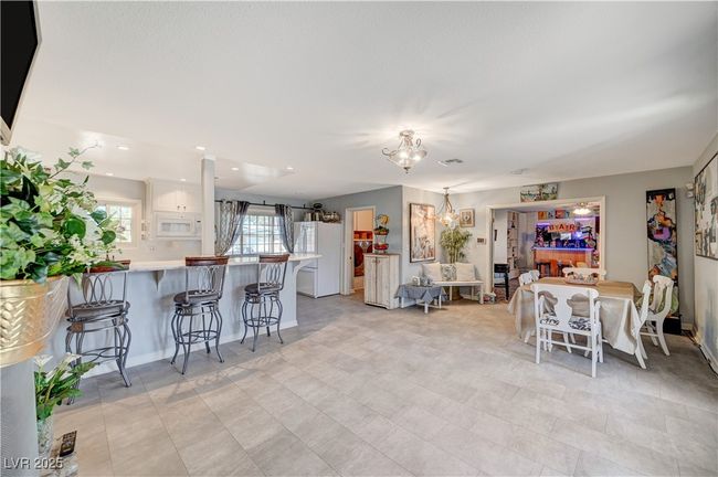 Dining area with a chandelier and baseboards | Image 33