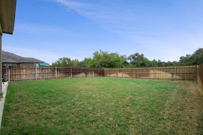 View of yard featuring a fenced backyard | Image 21