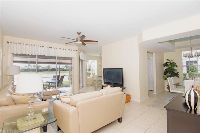 Enjoy the tropical breezes from your triple slider directly off the living room. | Image 6
