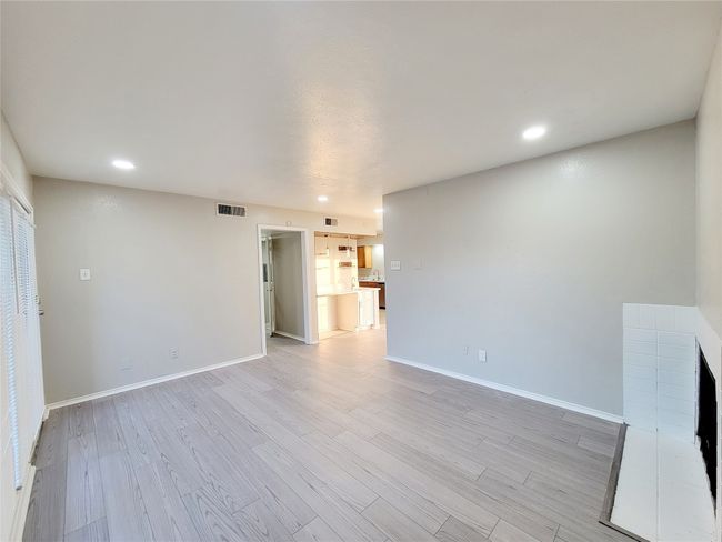 Unfurnished living room with light hardwood / wood-style floors | Image 8