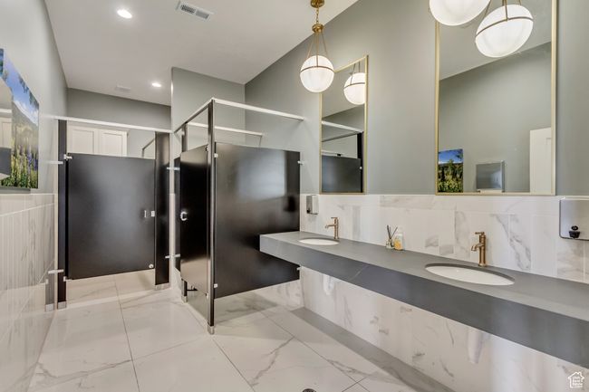 Full bathroom featuring recessed lighting, visible vents, marble finish floor, and a sink | Image 38