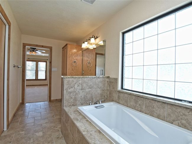 The soaking tub is perfect for relaxing after a long day enjoying beautiful Lake Travis. | Image 16