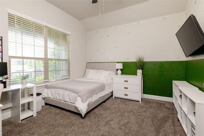 Office featuring carpeted floors, baseboards, vaulted ceiling and french doors | Image 14