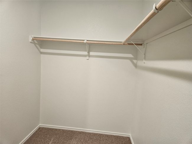 Walk in closet featuring carpet flooring | Image 11