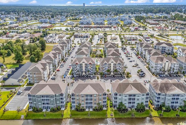 Aerial perspective of suburban area with a pool area | Image 14