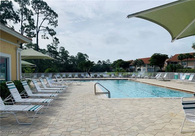 Community pool featuring a patio and fence | Image 10