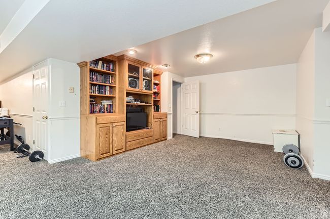 Living room with carpet flooring and baseboards | Image 18