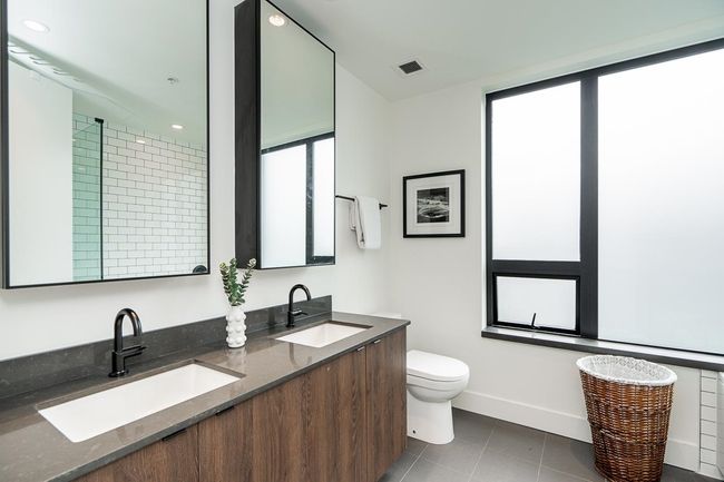 Bathroom with healthy amount of natural light, double vanity, tile patterned floors, and recessed lighting | Image 26