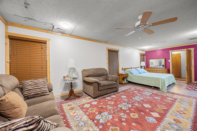 Bedroom and living room area. the utility room is on far end | Image 12