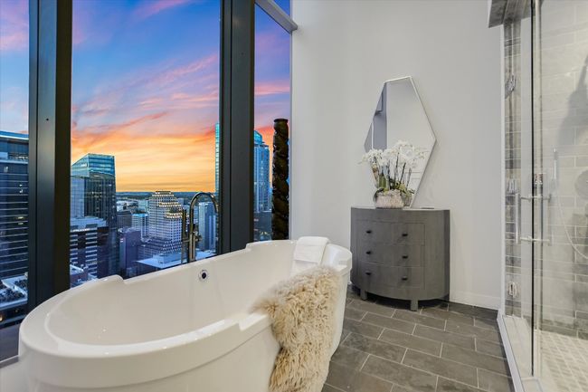A deep soaking tub is perfectly positioned to take in sweeping views—your personal spa escape. | Image 23